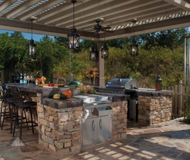 italian style outdoor kitchen and dining area